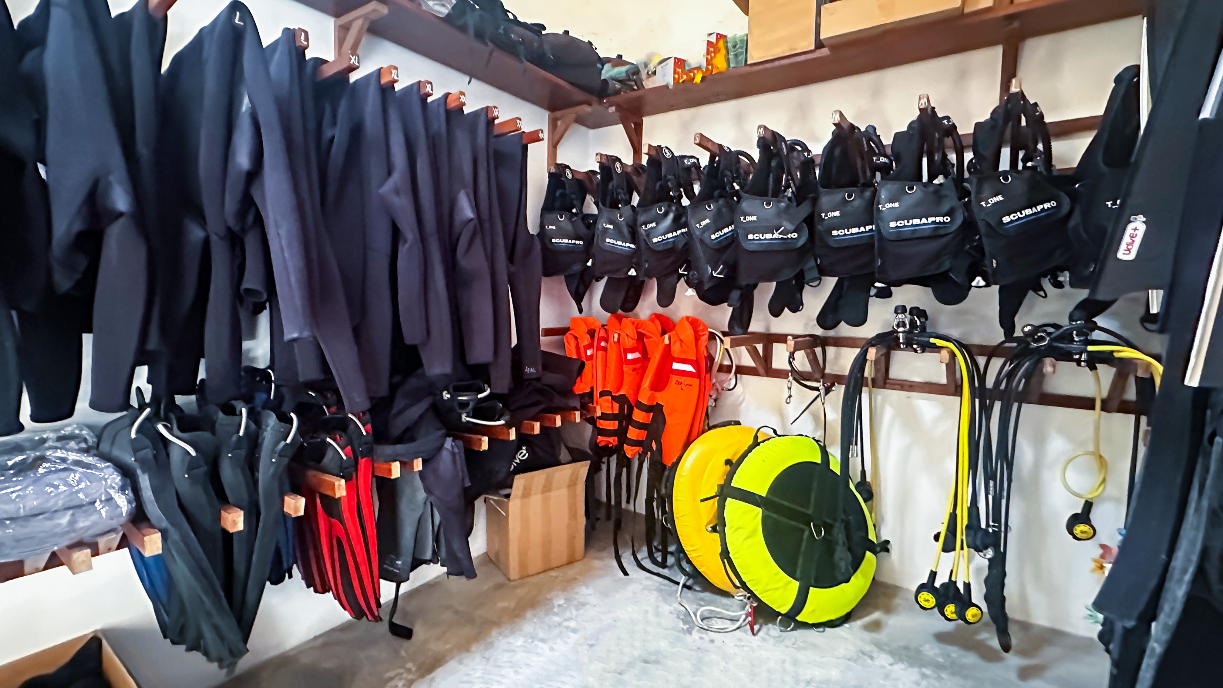 Dive Centre Equipment Room — Wetsuits & BCDs